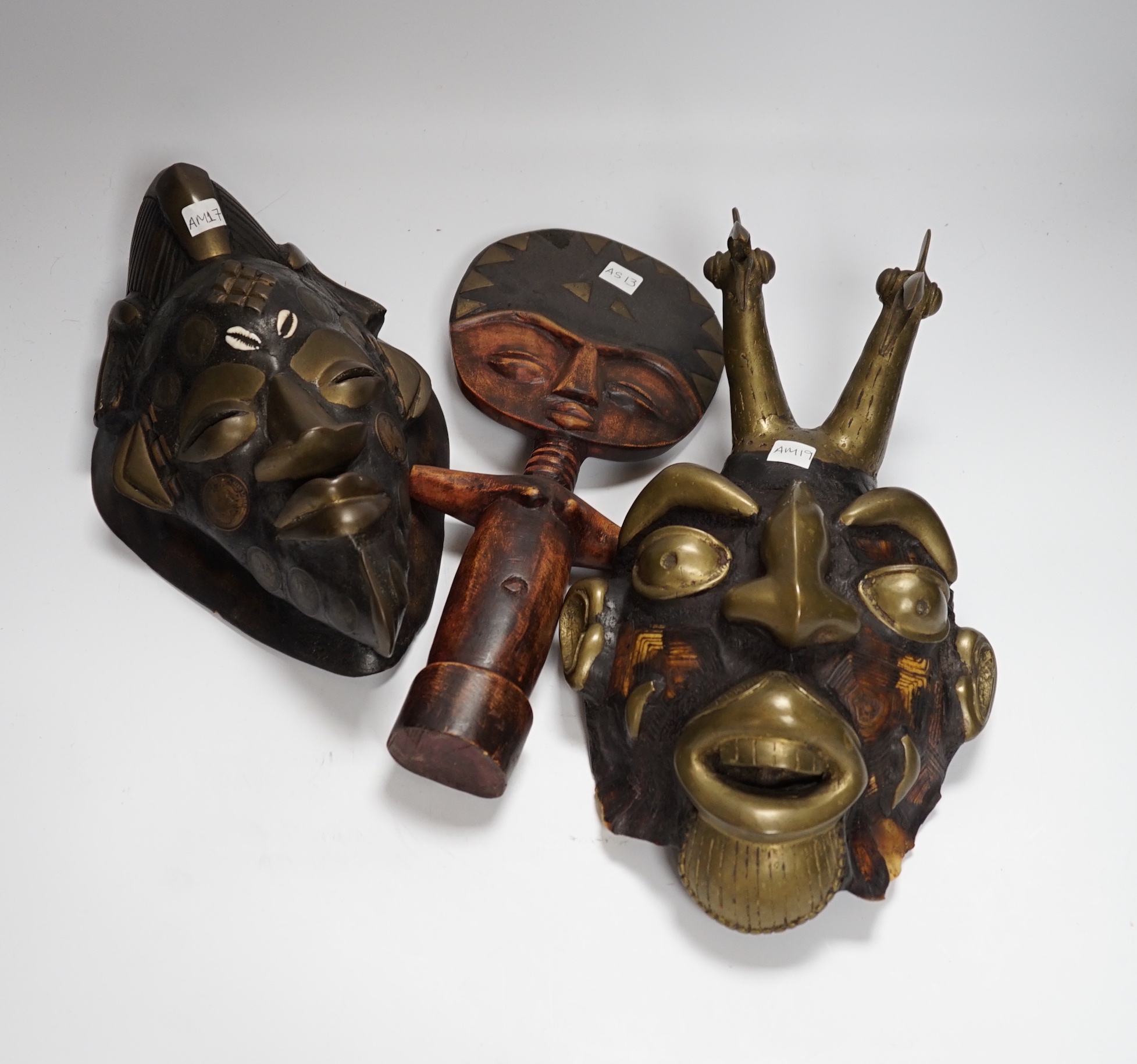 Two Lega tribal masks one made from a tortoise shell and an Ashanti fertility figure, tallest 32.5cm